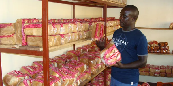 Man holding a loaf of bread